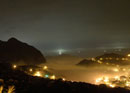 Clouds at Golden Coast, lights on the fishing boat.